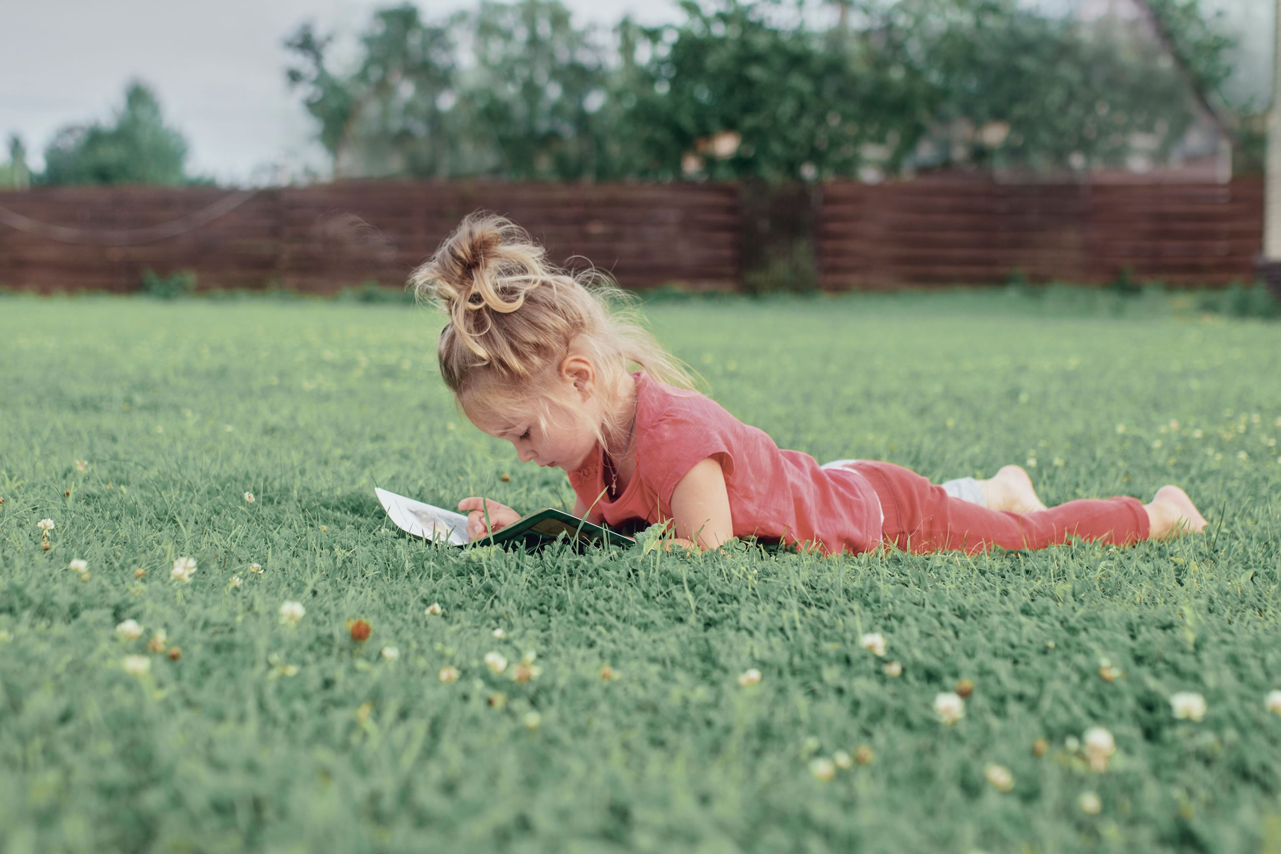 Child reading a Greek book